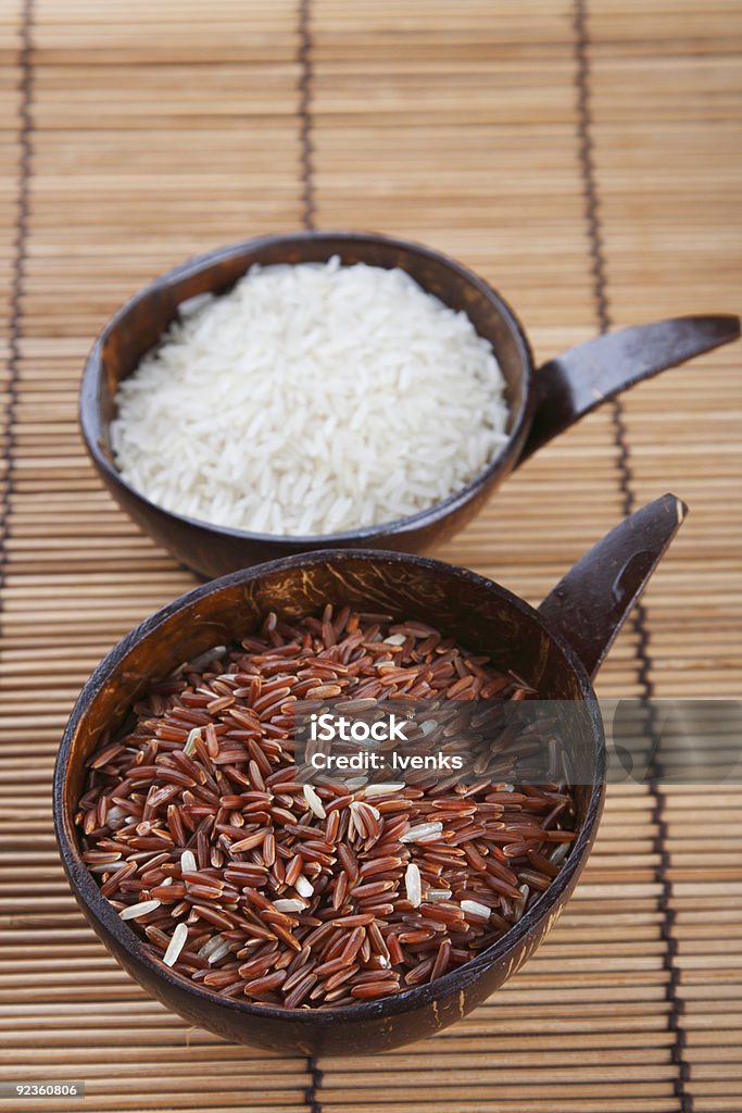 Himalayan Red Long grain and white Rice in coconut bowls  Brown Rice Stock Photo