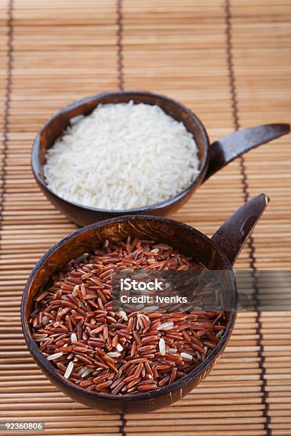 Himalayan Red Long Grain And White Rice In Coconut Bowls Stock Photo - Download Image Now