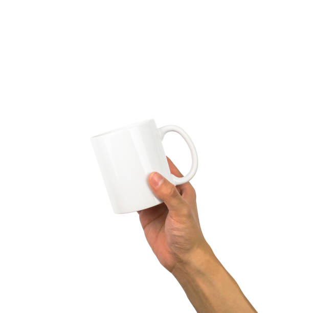 istock Mug on hand holding up isolated with clipping path 923608444