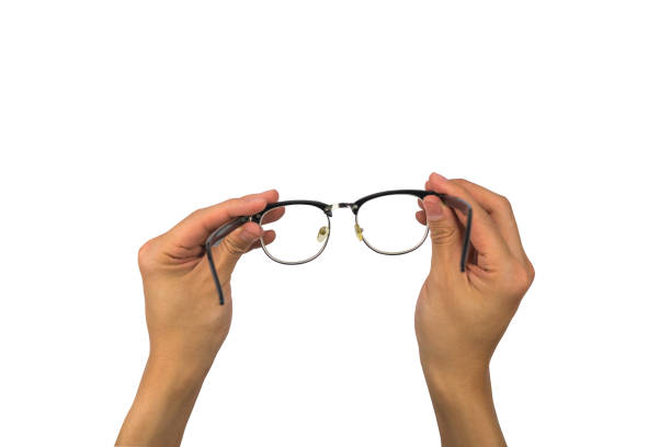 istock Vintage eye glasses hand holding isolated with clipping path 923609186