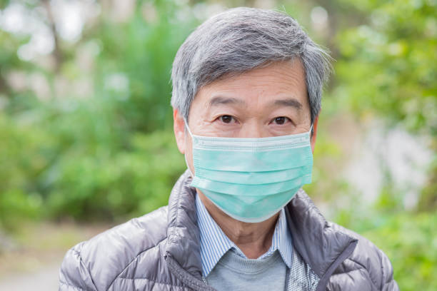old couple get cold old couple get cold and wear mask outdoor bed of hay stock pictures, royalty-free photos & images