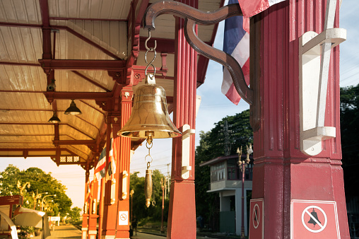 Bell hanging for hitting signal a train at the railway station in Thailand.