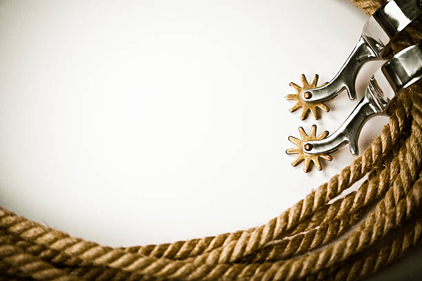A white background bordered in ropes and spurs stock photo