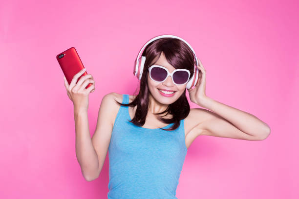 istock woman use phone listen music 923613550