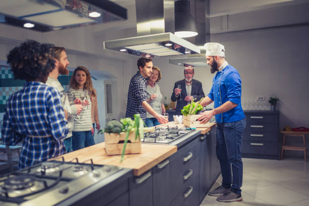 istock Young chef welcoming his cooking class 923613750