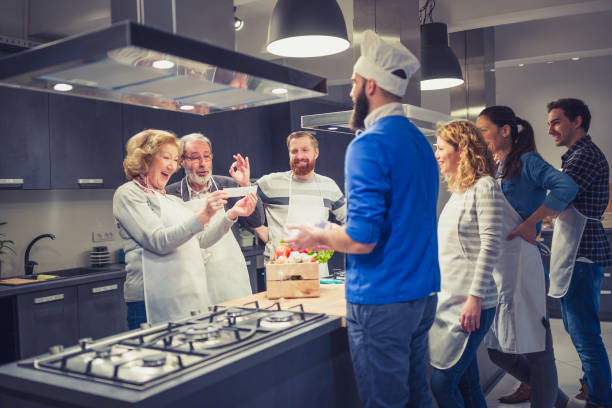 istock People in a cooking class enjoying their time 923613934