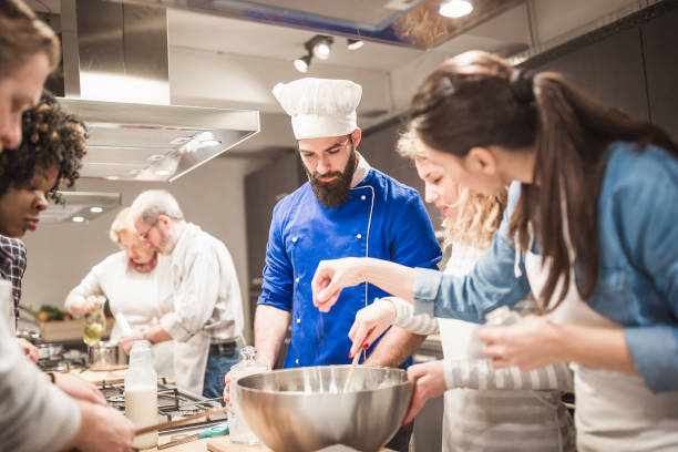 istock People in a cooking class enjoying their time 923614036