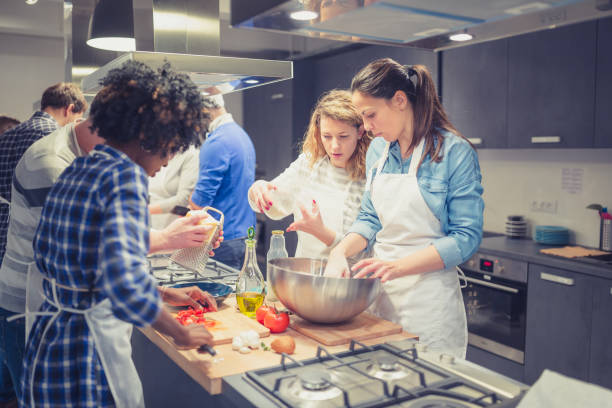 istock People in a cooking class enjoying their time 923614108