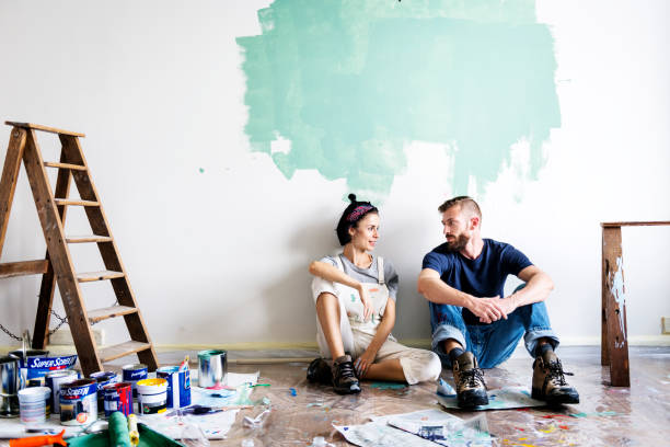 istock Couple renovating the house 923614456