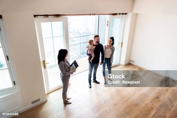 Family Buying New House Stock Photo - Download Image Now - Moving House, Buying, Home Ownership