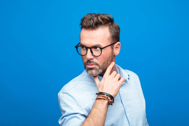 istock Summer portrait of handsome man, blue background 923616700