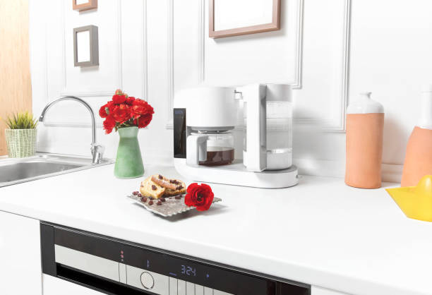 Beautiful white kitchen in new luxury home Beautiful white kitchen in new luxury home coffee maker in kitchen stock pictures, royalty-free photos & images