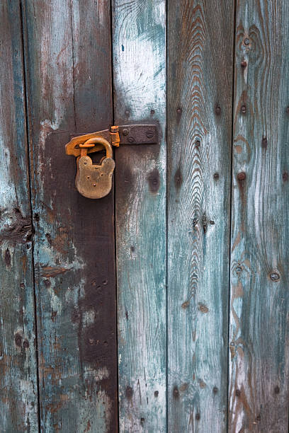 istock Old wooden door with rusty padlock 92361783