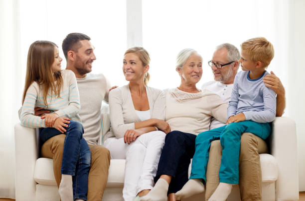 istock happy family sitting on couch at home 923619802