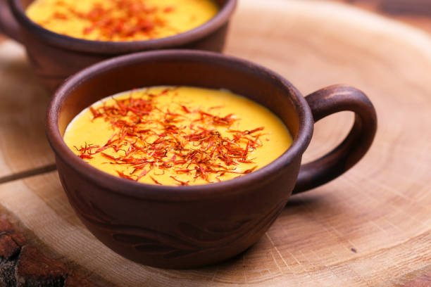istock Indian turmeric milk with saffron, cardamom and turmeric. Copyspace 923621948