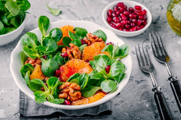 istock Green Lamb’s lettuce corn salad with blood oranges, walnuts, pomegranate and chia seeds 923622092