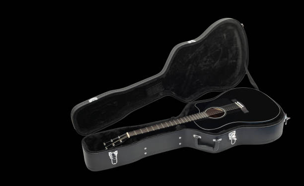 istock Musical instrument - Acoustic guitar hard case black background 923622146
