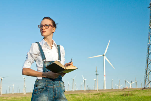 istock Happy female engineer at wind farm 923622660