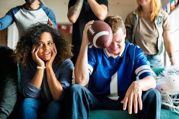 Friends cheering sport league together