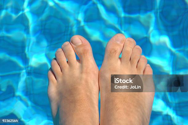 Feet In Water On Swimming Pool Stock Photo - Download Image Now - Color Image, Healthy Lifestyle, Horizontal
