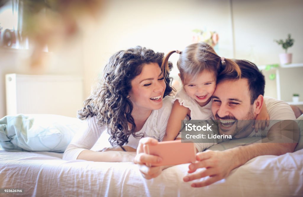 Let take a photo of our happy family. Family Stock Photo