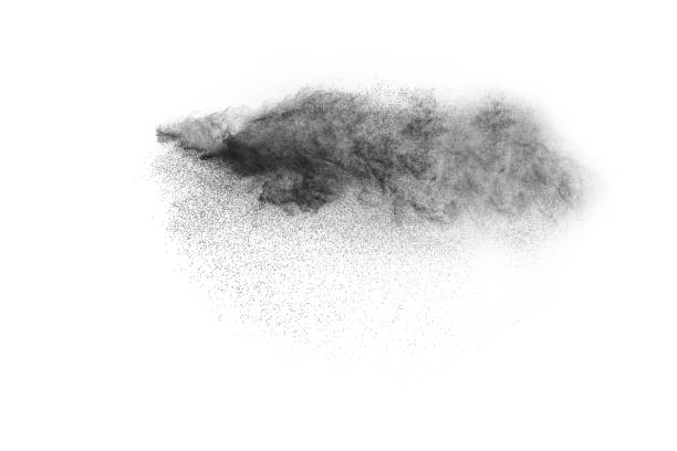istock Black powder explosion against white background.The particles of charcoal splatted on white background. Closeup of black dust particles explode isolated on white background. 923626582
