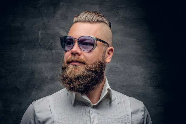 istock A bearded male in violet sunglasses, dressed in a white shirt. 923626802
