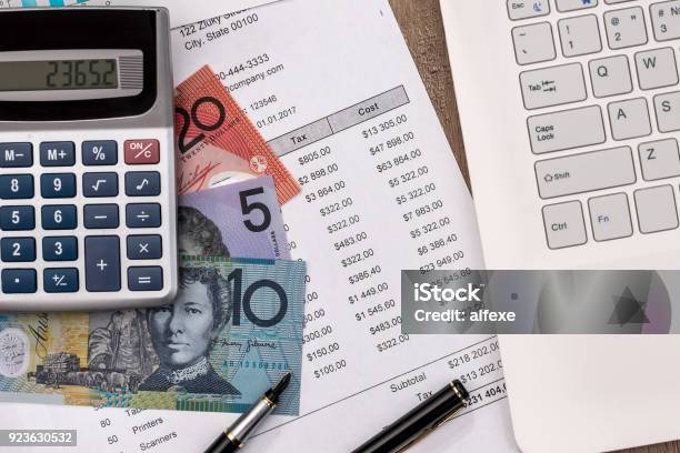 Australian Dollar With Graph Home Budget Laptop And Calculator Stock Photo - Download Image Now