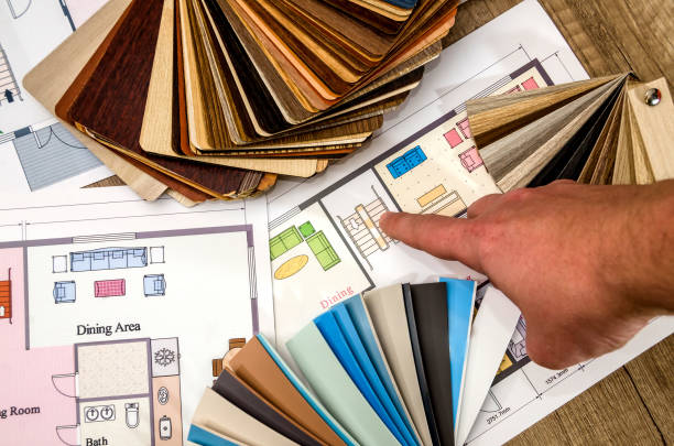 istock The architect's hand points to the design of the house 923634618