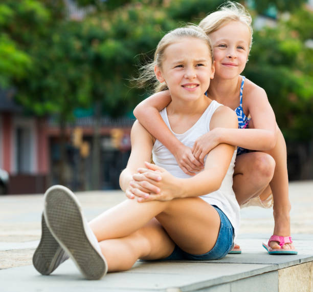 istock Two small happy sisters outdoors 923638542