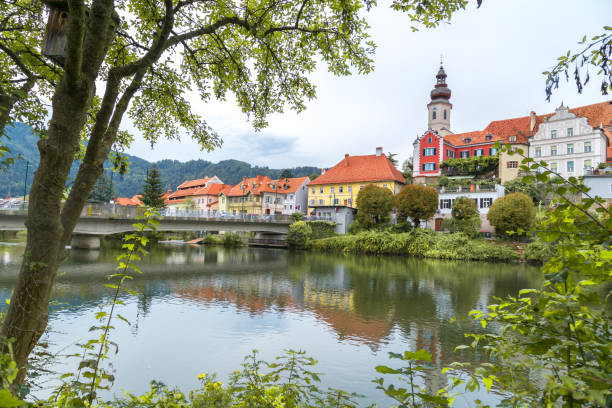 Frohnleiten by Mud River in Styria Frohnleıten: Old town view of small city Frohnleiten near Mur River in Styria region of Austria. frohnleiten stock pictures, royalty-free photos & images