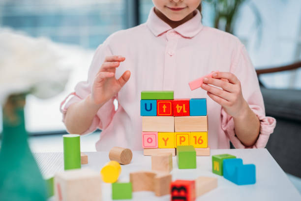 istock partial view of kid playing with colorful blocks at home 923639766