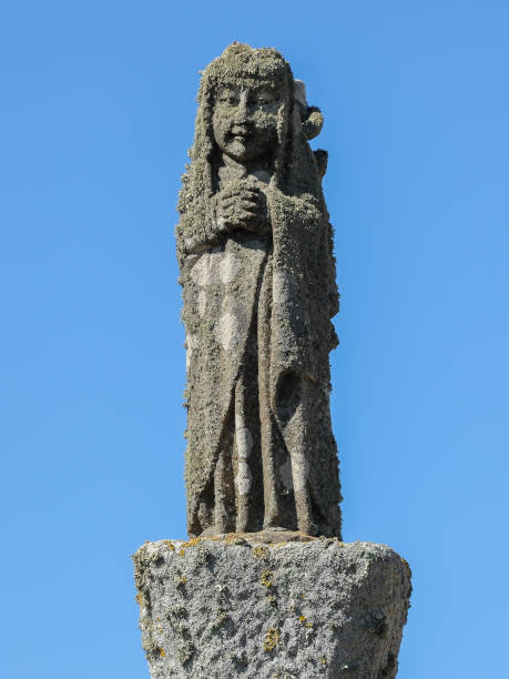 istock Stone figure in front of Chapelle Saint-They de la pointe du Van 923642248