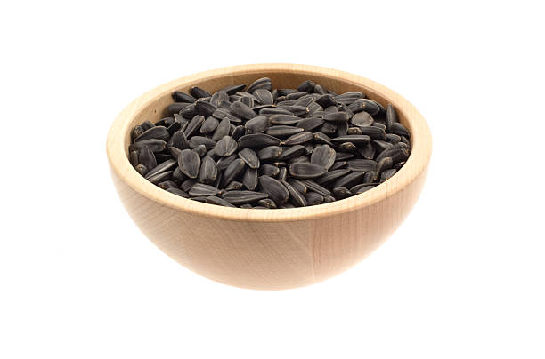 istock sunflower seeds in a wood bowl 92364337