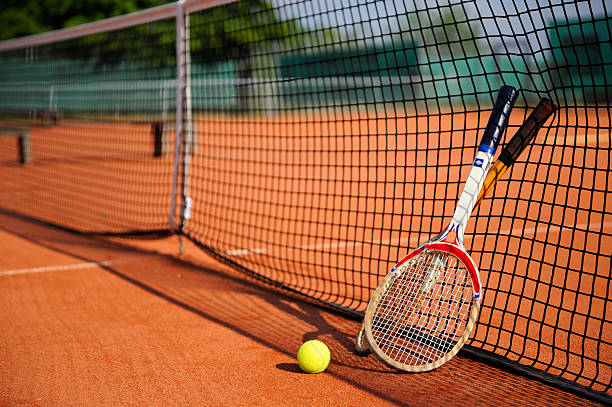 istock old tennis racket, ball and a net 92364478