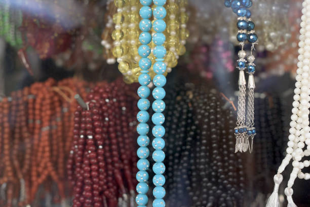 Colorfull Rosaries hanging on Shop stock photo