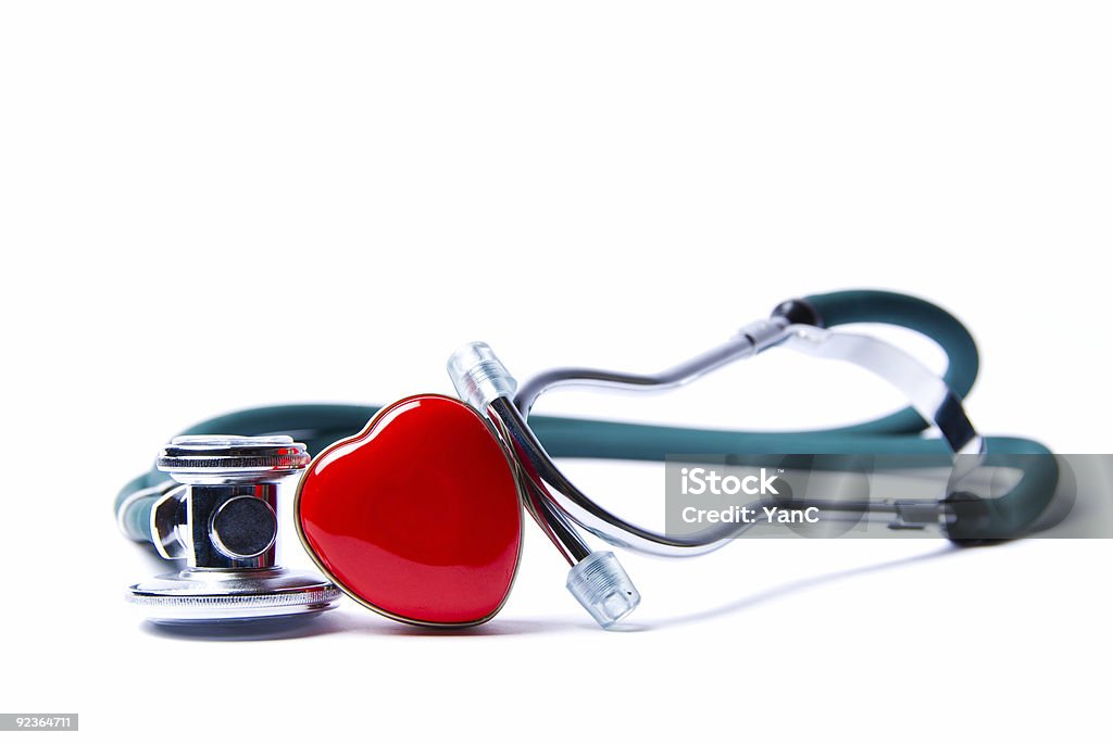 A blue stethoscope with a heart Stethoscope in green on an isolated white background Body Care Stock Photo