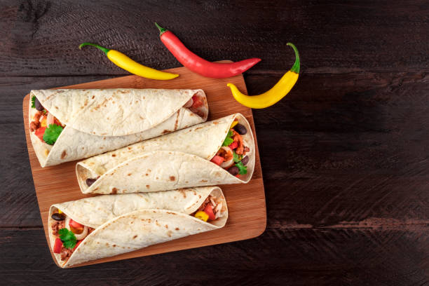 istock Mexican burritos with chili peppers, and copyspace 923649192