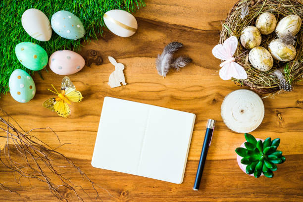 istock Blank notebook and pen with free space and easter decorations from above 923652752