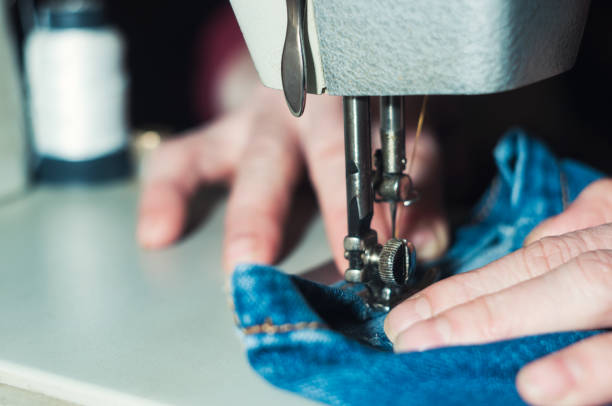 istock The elderly seamstress is working on sewing machine 923653428