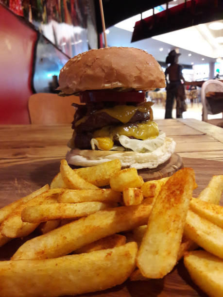 istock Tall Hamburger with Potatoes served at Restaurant. 923656396