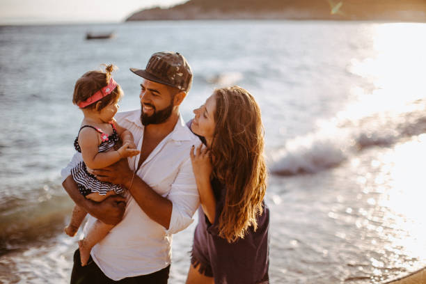 istock Beautiful family have fun on the beach 923656800
