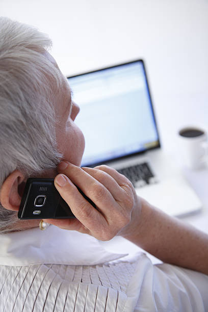 istock Business woman talking on cellphone 92365897