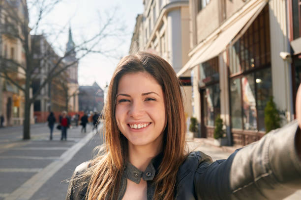 istock young girl make a selfy on the street in spring 923659834