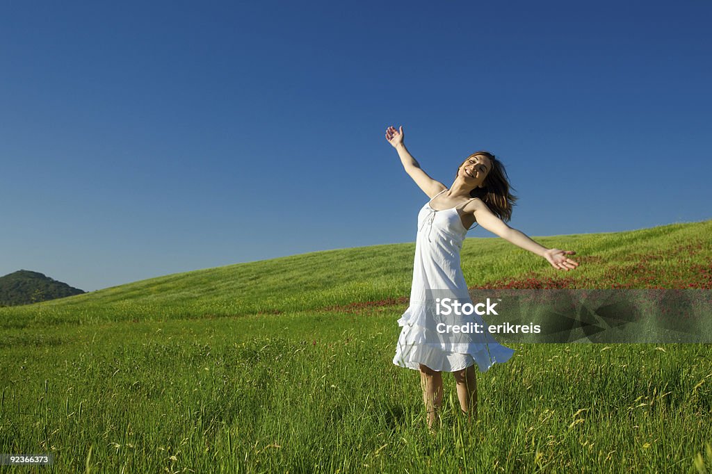 Young woman relaxing Beautiful young woman relaxing on the field One Woman Only Stock Photo