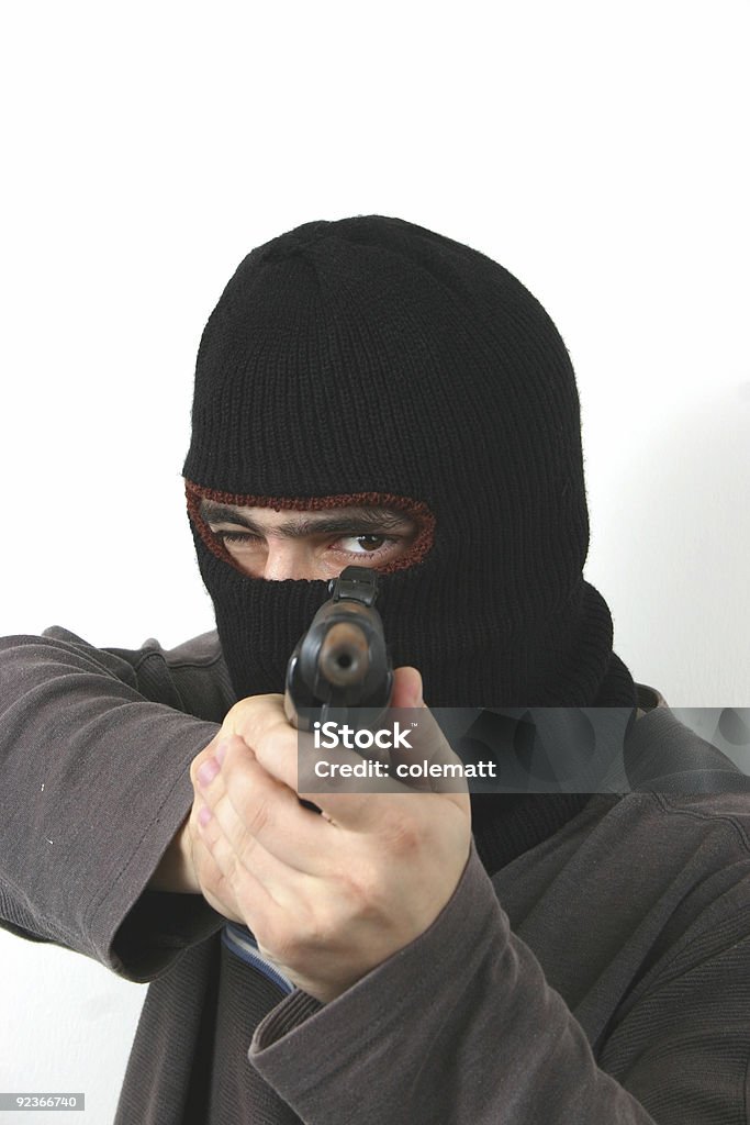 scary young man 2 scary young fella with a big gun Adult Stock Photo