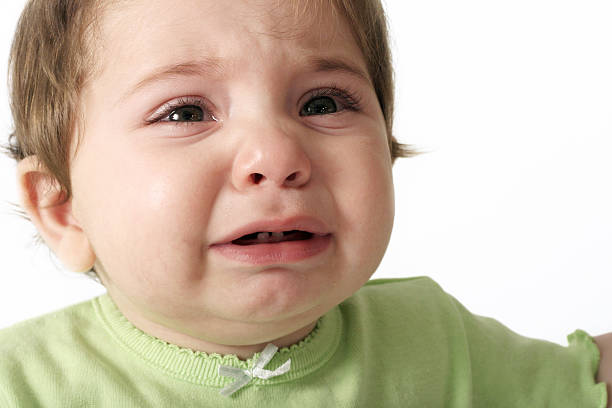 Crying Baby Tears Baby crying... Teething Fever stock pictures, royalty-free photos & images