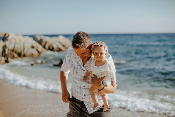 istock Dad and child daughter playing together outdoors on a summer 923670642