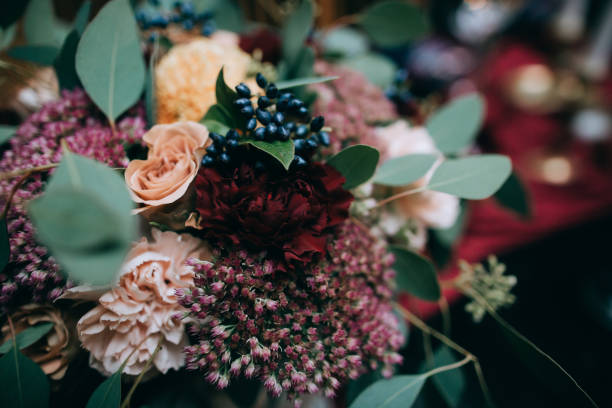 istock Elegant Wedding table decor with red flowers and red table cloth 923670772