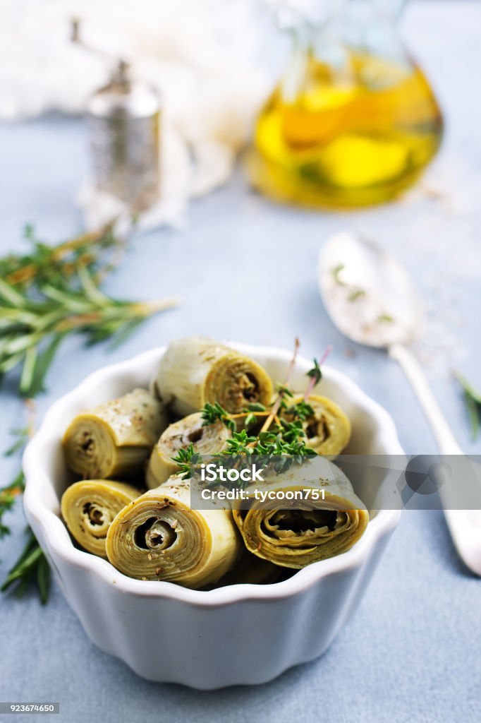 Artichoke hearts Artichoke hearts in white bowl , Artichoke hearts with marinade Artichoke Stock Photo